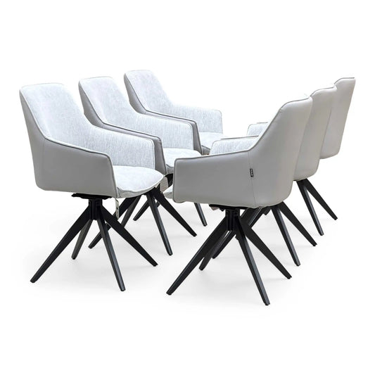 Full View ‘Jose’ contemporary dining armchairs, showing a matching set of 6 individual chairs beautifully upholstered in a durable Stone Grey fabric with integrated swivel mechanisms.