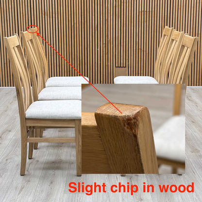 close-up macro view focusing on the backrest woodwork, highlighting the smooth finish, rich natural grain patterns of the timber, and the precise alignment of the vertical slats.Small defect on the chair.