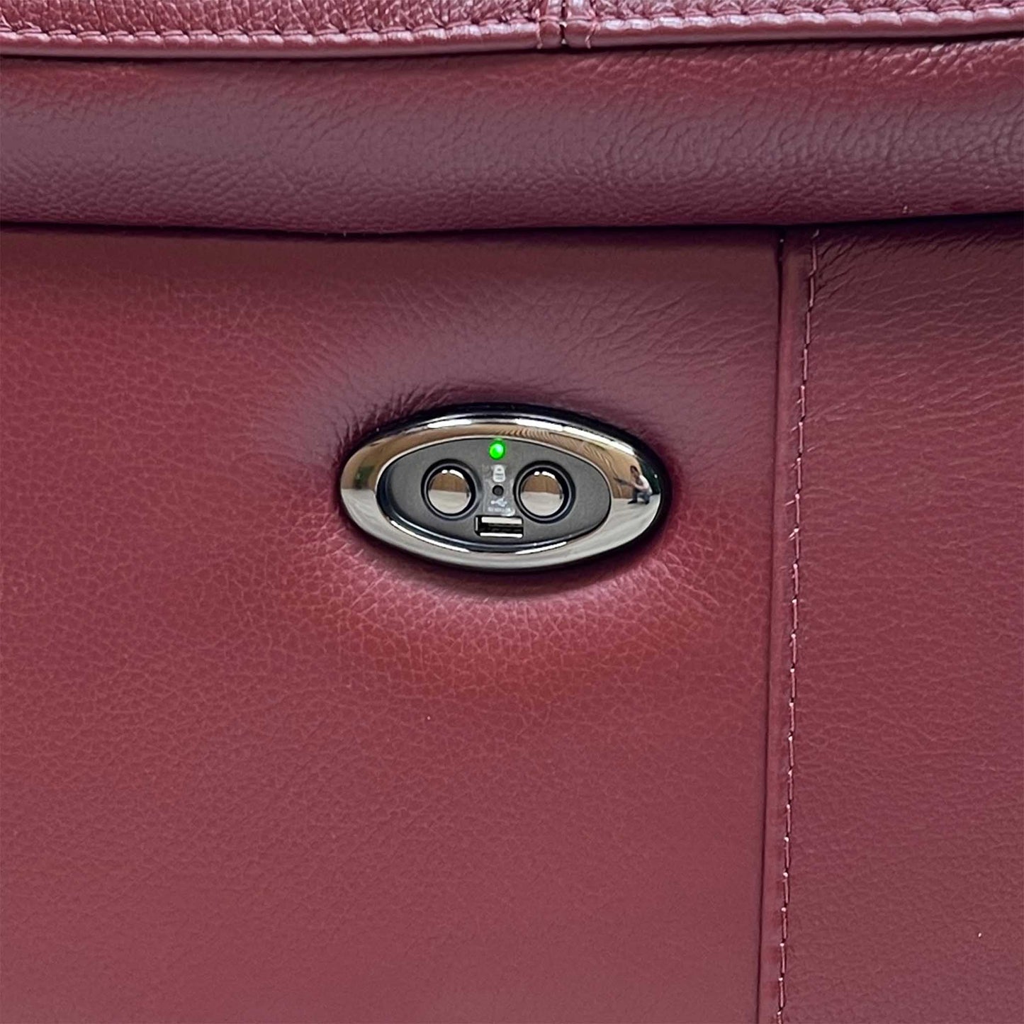 Close-up view focusing on the smooth electronic control switch panels mounted seamlessly on the outer side borders, displaying integrated power reclining adjustment buttons and built-in USB charging ports.