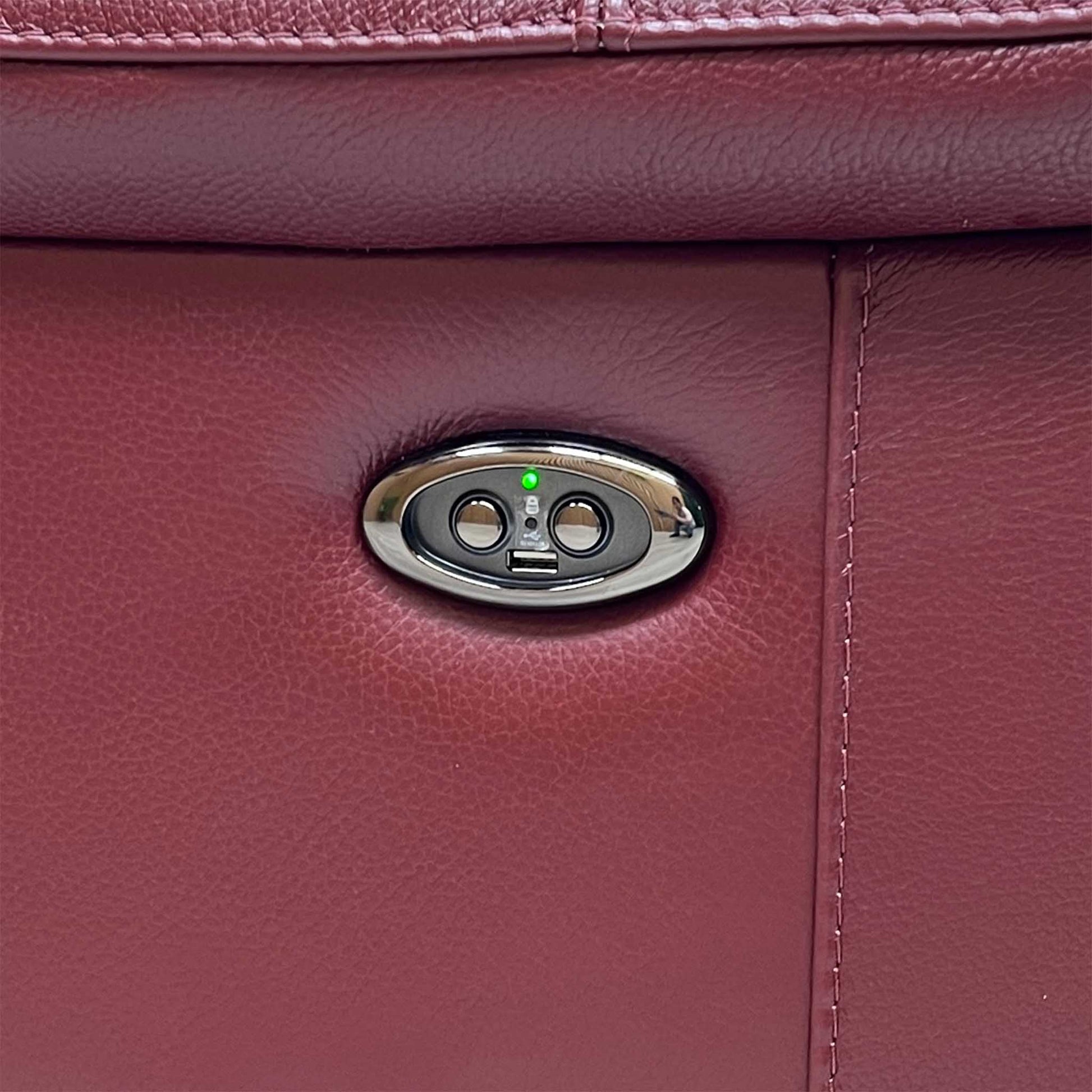 Close-up view focusing on the smooth electronic control switch panels mounted seamlessly on the outer side borders, displaying integrated power reclining adjustment buttons and built-in USB charging ports.