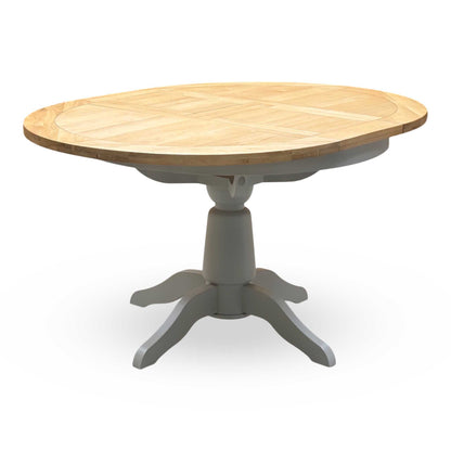 ‘Lewis’ Natural Oak Round Pedestal Butterfly Extending Dining Table with Mist Grey Fabric Button Back Dining Chairs - Set of 4 Furniture Village