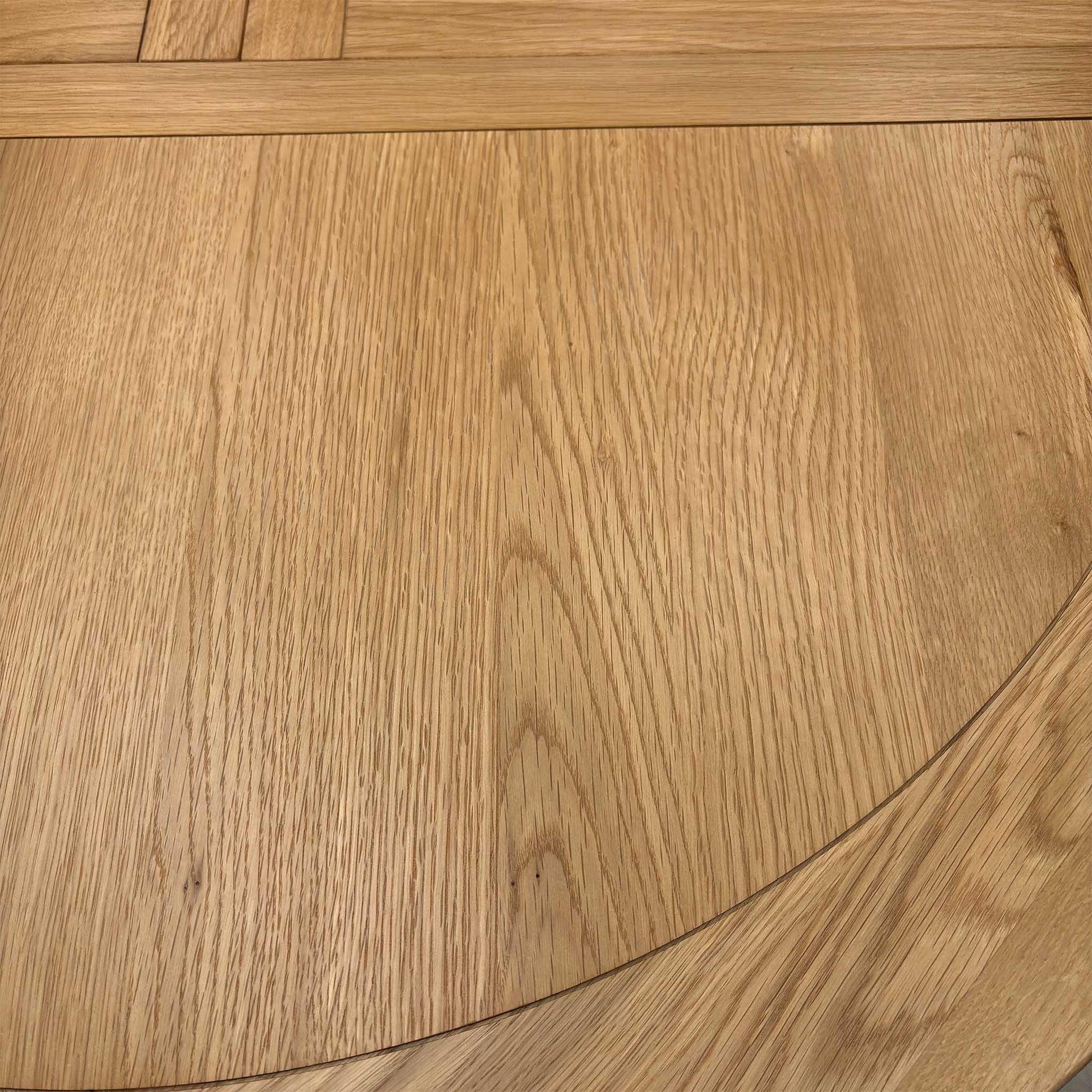 ‘Lewis’ Natural Oak Round Pedestal Butterfly Extending Dining Table with Mist Grey Fabric Button Back Dining Chairs - Set of 4 Furniture Village