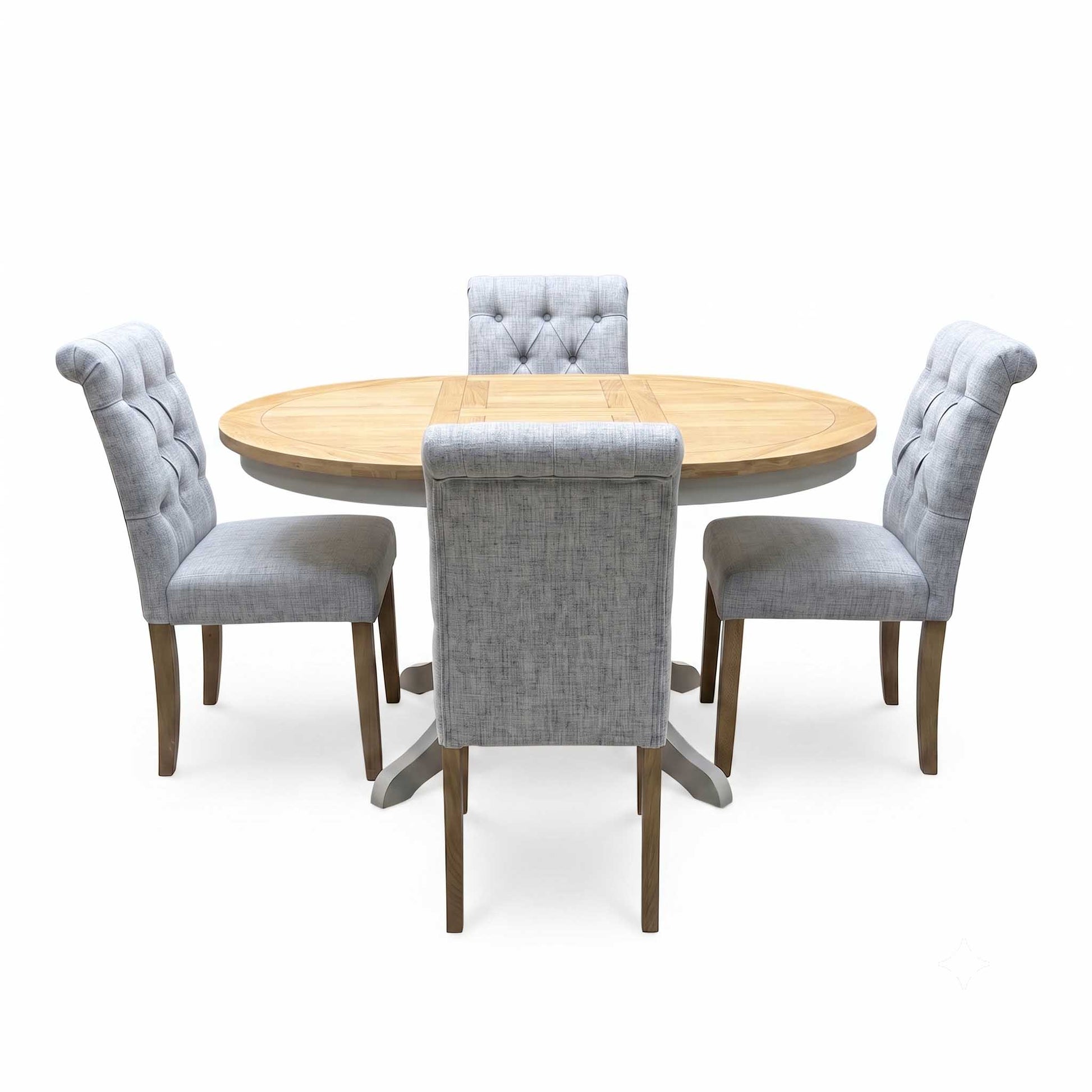 ‘Lewis’ Natural Oak Round Pedestal Butterfly Extending Dining Table with Mist Grey Fabric Button Back Dining Chairs - Set of 4 Furniture Village