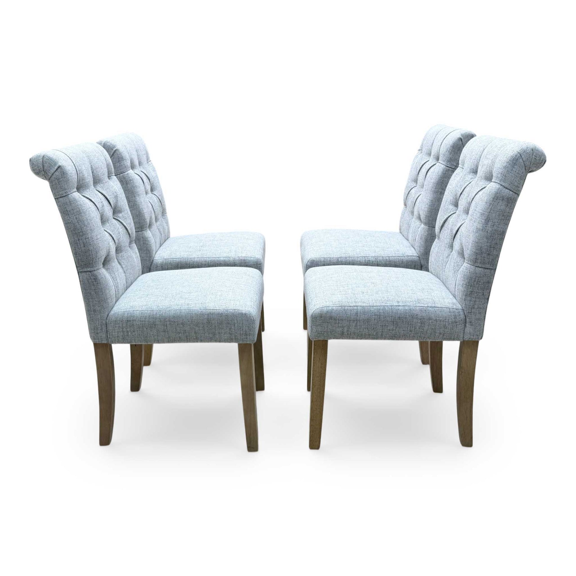 ‘Lewis’ Natural Oak Round Pedestal Butterfly Extending Dining Table with Mist Grey Fabric Button Back Dining Chairs - Set of 4 Furniture Village