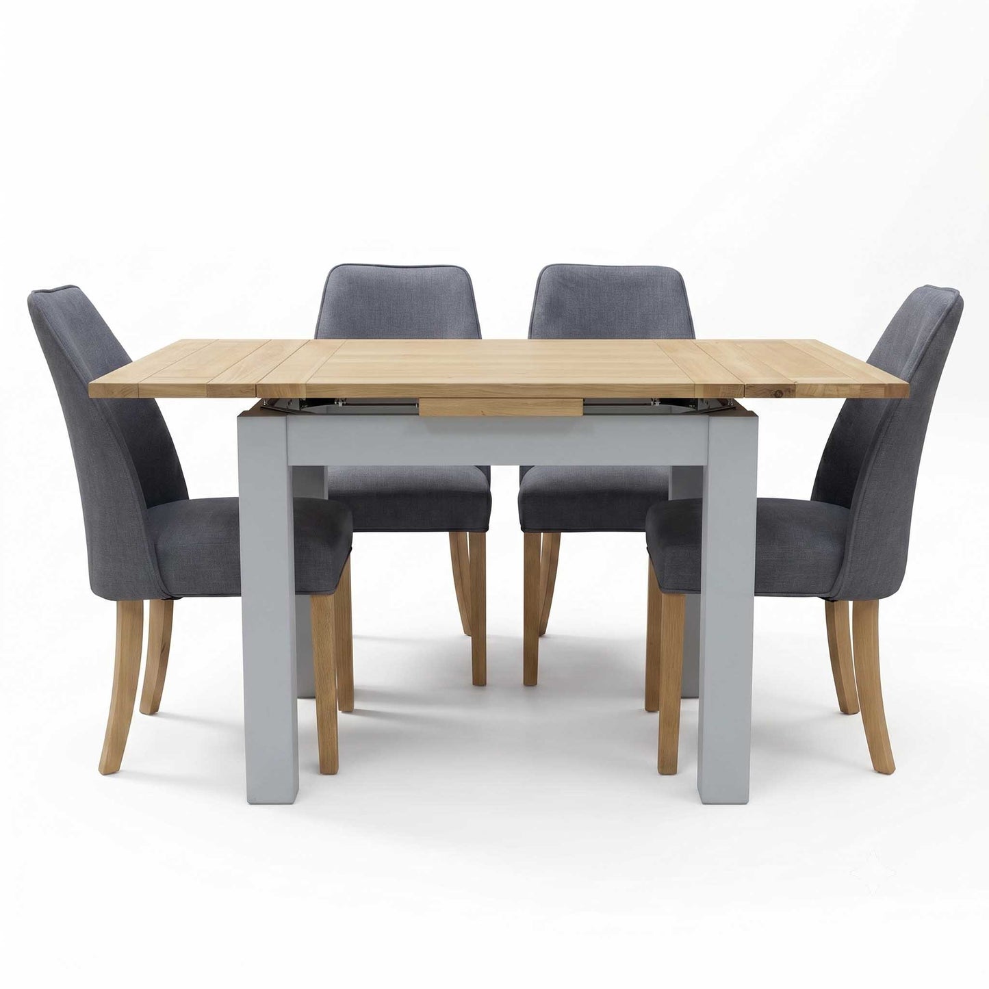‘Hamilton’ Solid American Oak Draw Leaf Extending Dining Table with Charcoal Grey Fabric Dining Chairs - Set of 4 Furniture Village