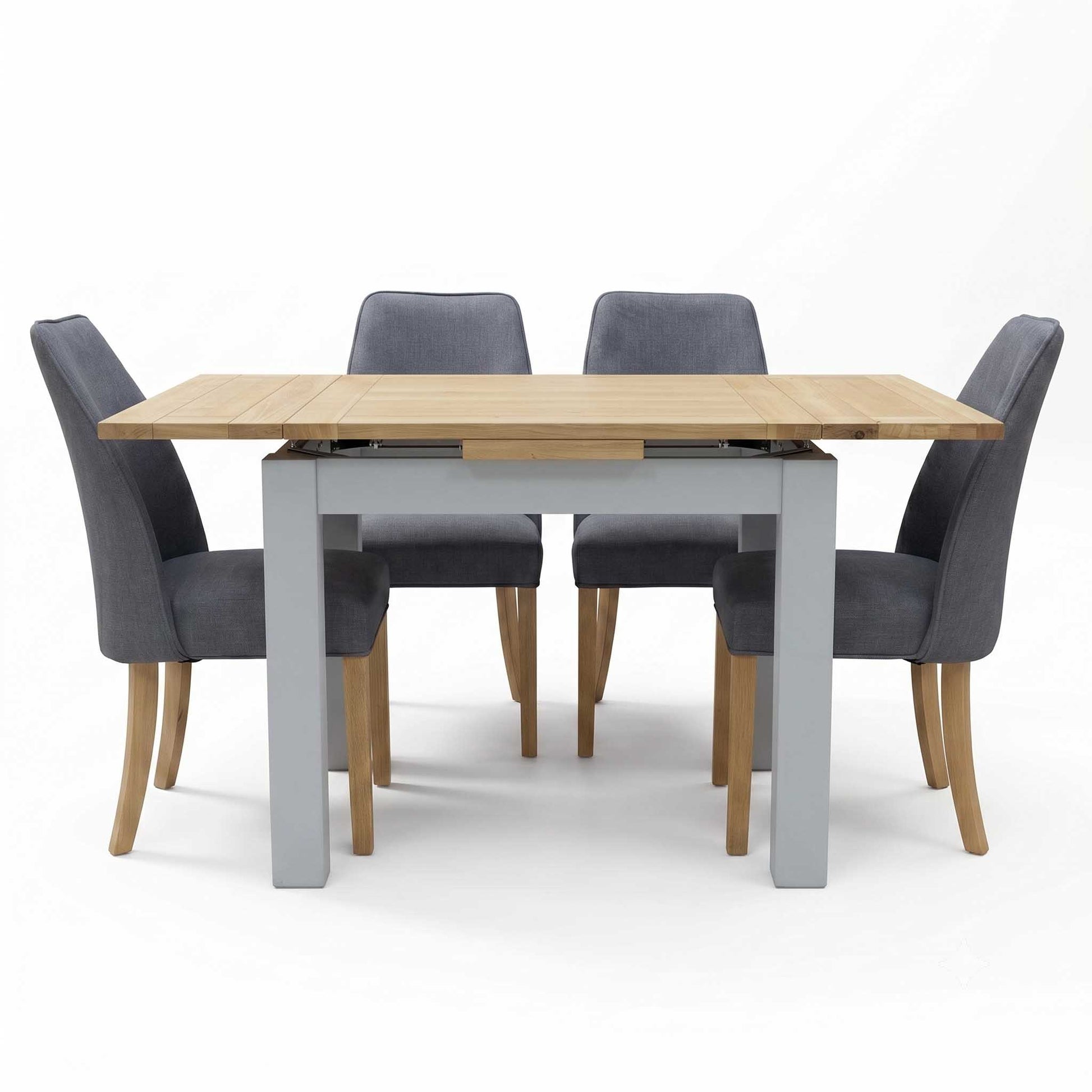 ‘Hamilton’ Solid American Oak Draw Leaf Extending Dining Table with Charcoal Grey Fabric Dining Chairs - Set of 4 Furniture Village