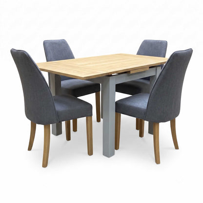 ‘Hamilton’ Solid American Oak Draw Leaf Extending Dining Table with Charcoal Grey Fabric Dining Chairs - Set of 4 Furniture Village