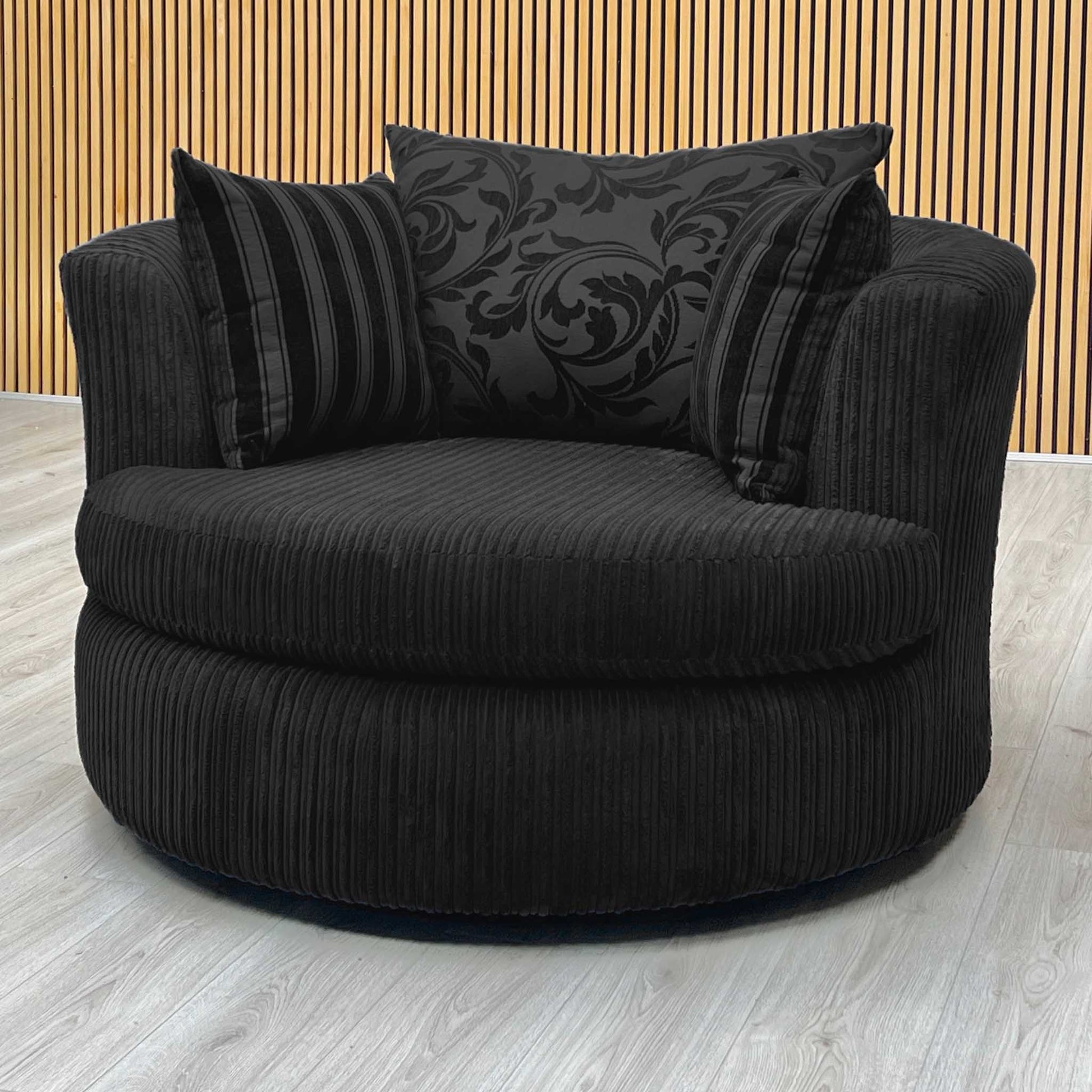 ‘Celine' Black Celine Cord Fabric Large Swivel Chair DFS