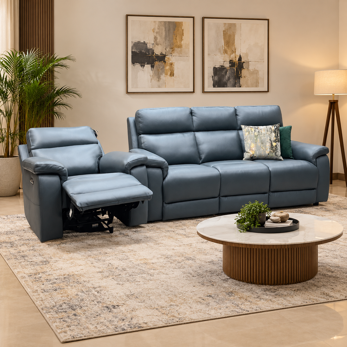 Raven peacock green leather 3 seater sofa and reclined power chair in a living room with a round coffee table