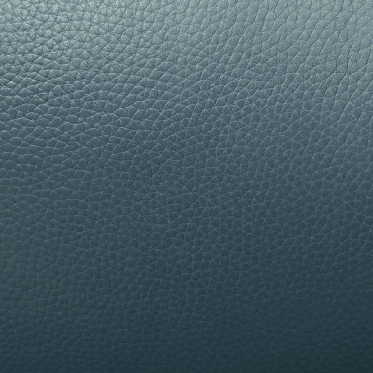 Close-up of the peacock green grained leather used on the Raven sofa and power chair