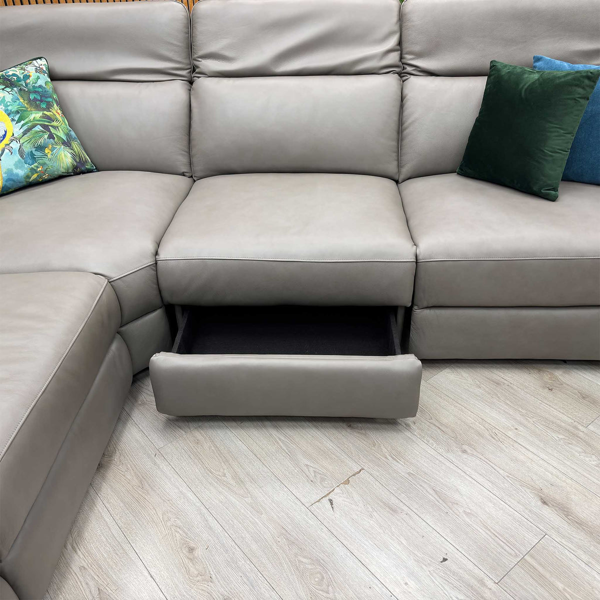 Ankara mushroom grey leather corner sofa with the storage drawer under the middle seat pulled open