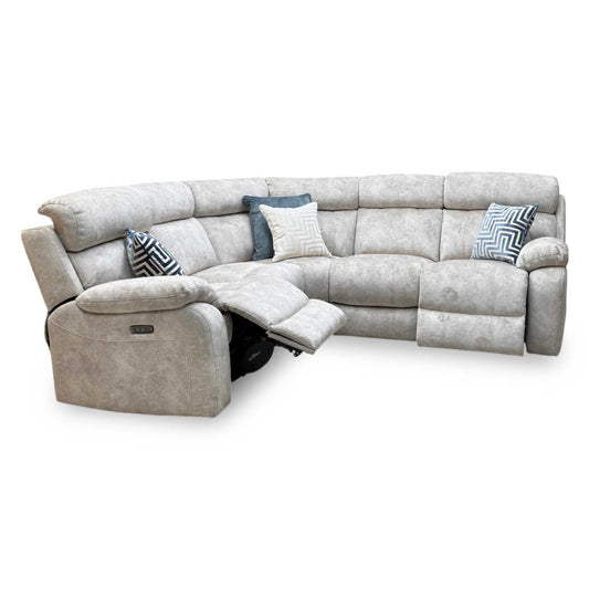 Moreno cream fabric large power recliner corner sofa, angled view with the left end recliner extended