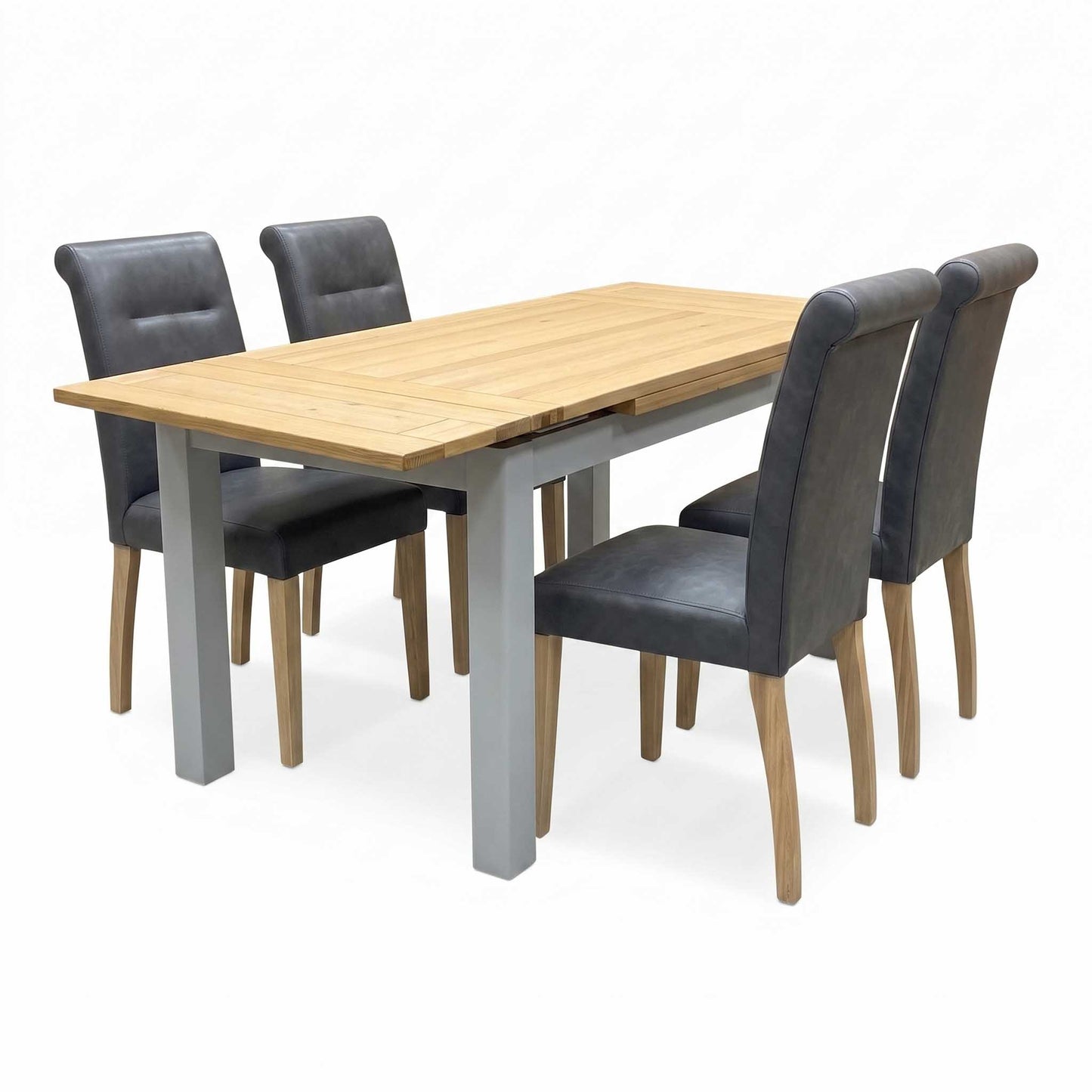 ‘Lewis’ Solid Oak 120cm Large Draw Leaf Extending Dining Table with Dark Grey Faux Leather Roll Back Dining Chairs - Set of 4
