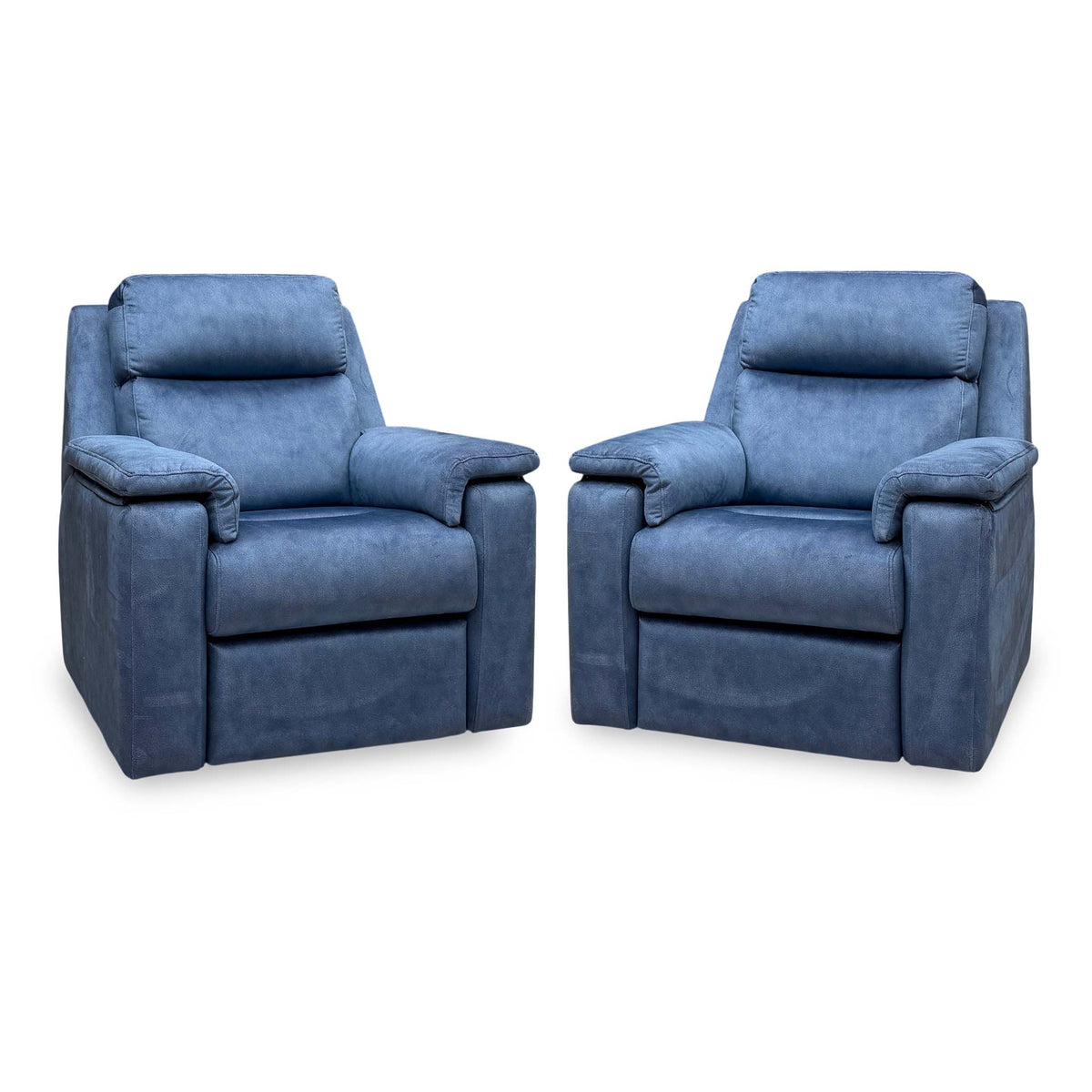 Angled view of the pair of G Plan Thornbury indigo velvet chairs from the set, both upright