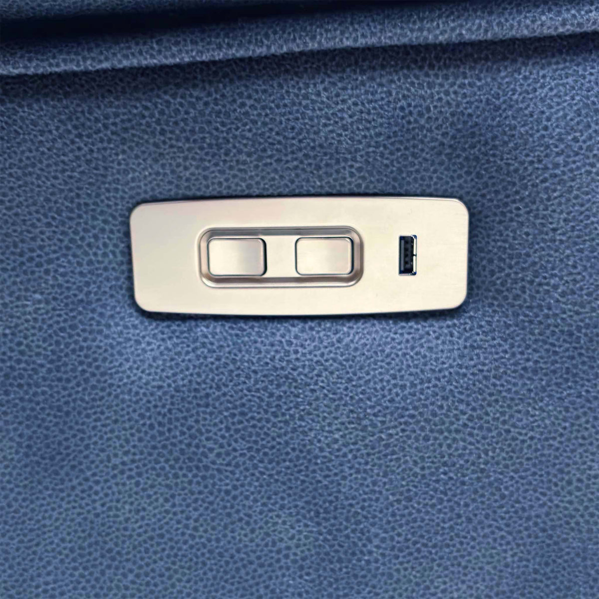 Close-up of the power recline control buttons and USB port on the G Plan Thornbury indigo velvet 3 seater sofa