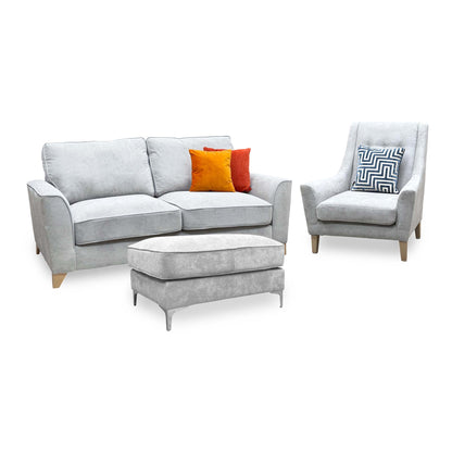 Legend Kingston silver fabric 3 seater sofa with accent chair on the right and footstool, angled view