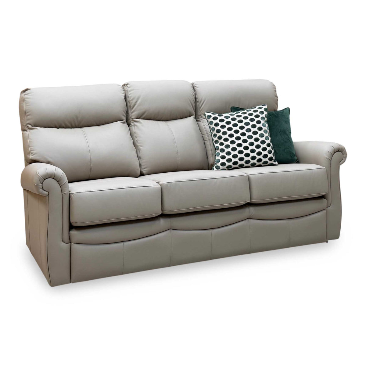 G Plan Avon taupe leather 3 seater sofa, angled view with scroll arms and green spotted scatter cushions