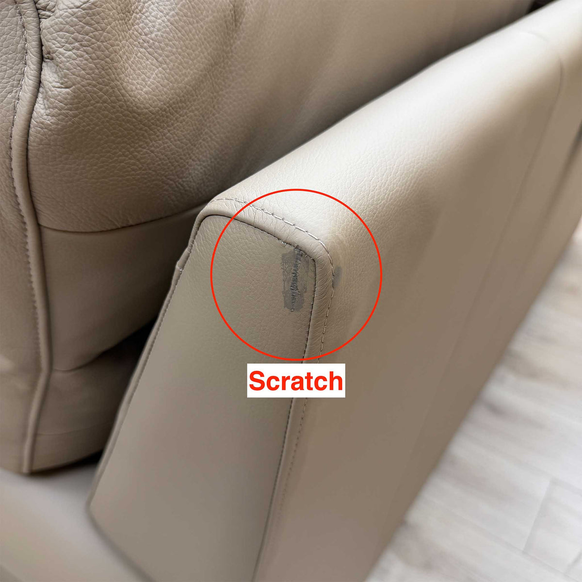 G Plan Avon taupe leather sofa with a scratch circled on the top front corner of the arm