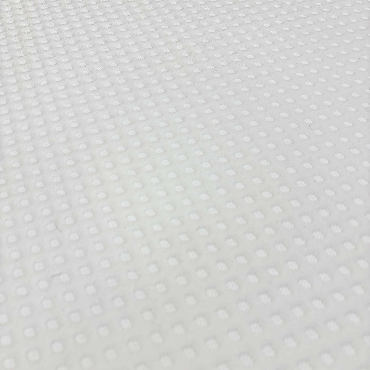 Close-up of the white textured top cover fabric on the Simba Ultra Hybrid 7300 mattress