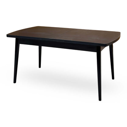 Magda black oak dining table unextended from the right side, showing the centre join in the top