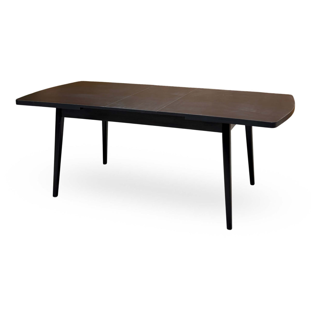 Magda black oak extending dining table extended, angled view from the right showing the three-part top