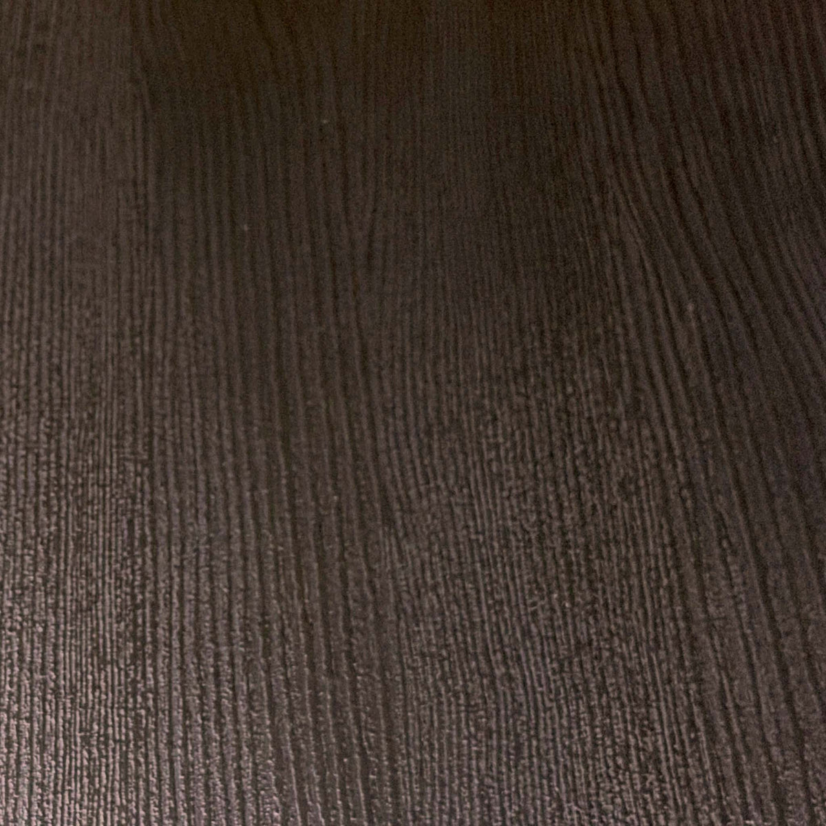 Close-up of the black grained oak finish used on the Magda dining table