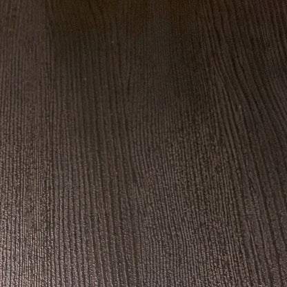 Close-up of the black grained oak finish used on the Magda dining table