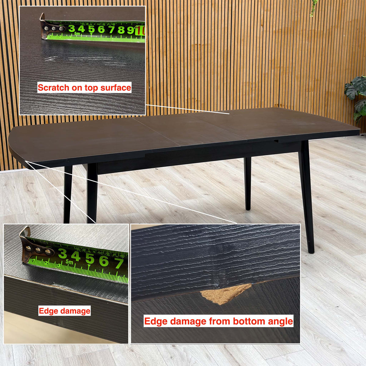 Magda black oak table with a scratch on the top and two edge chips marked, tape measure for scale