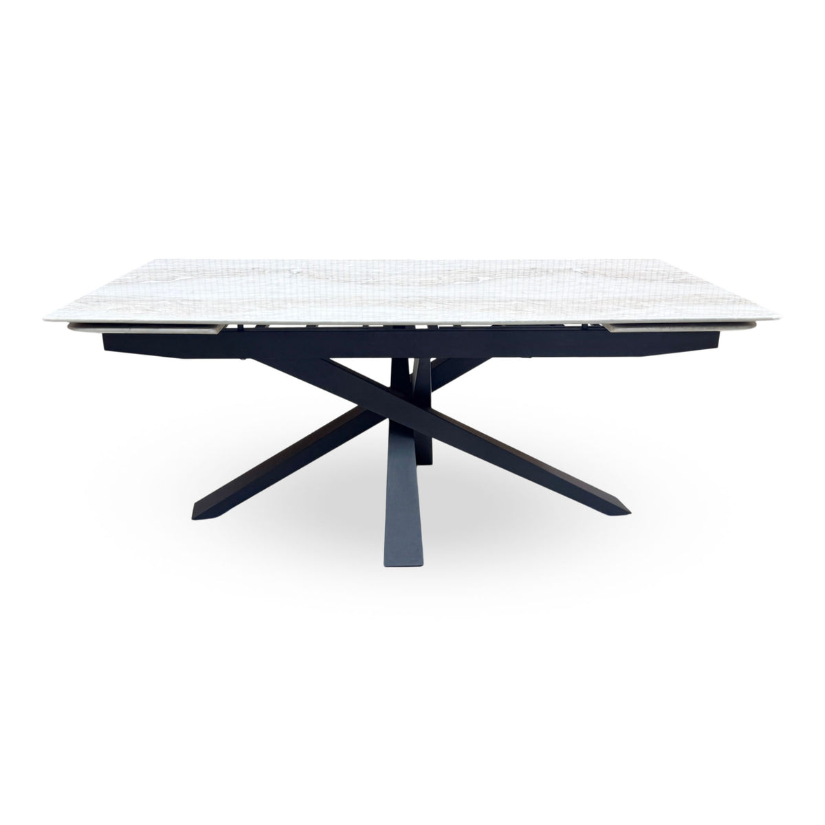 Front view of the Germain real marble top large extending dining table closed on its black metal star base