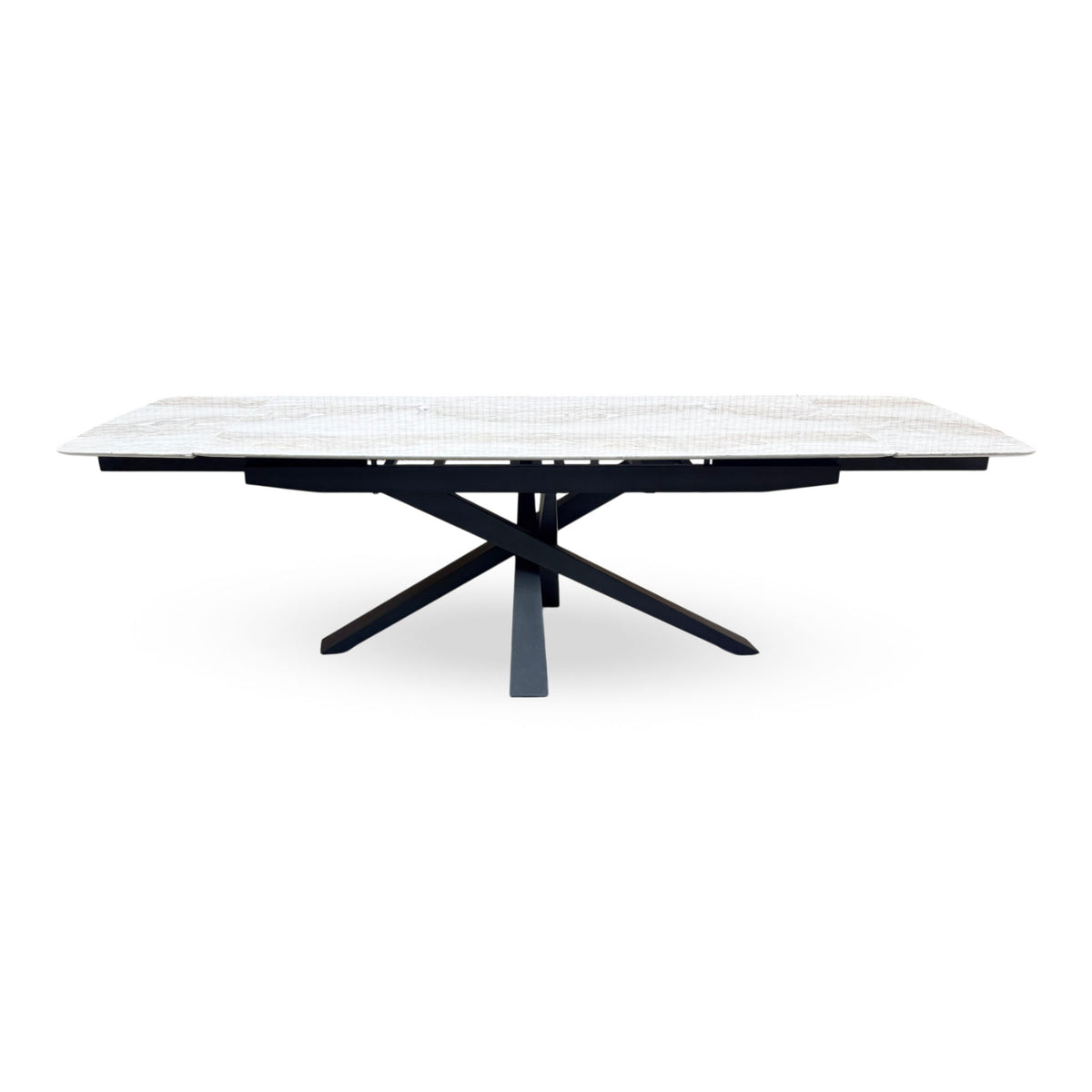 Front view of the Germain real marble top large extending dining table fully extended with both leaves out