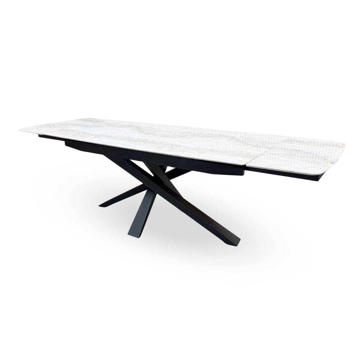 Germain real marble top extending dining table fully extended, angled view from the right end