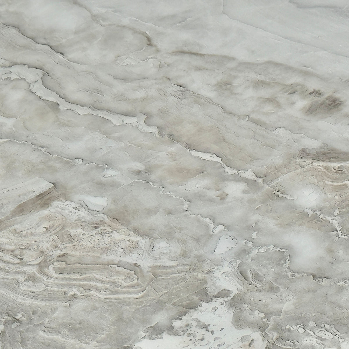 Close-up of the grey-veined white real marble top on the Germain extending dining table