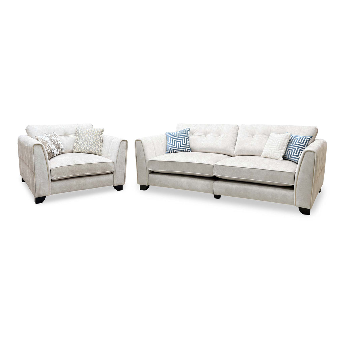 Mariah ivory velvet 4 seater split frame sofa and snuggler chair, angled view with blue patterned cushions