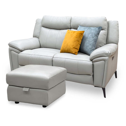 Panache lead grey leather 2 seater power recliner sofa angled from the left with the footstool in front
