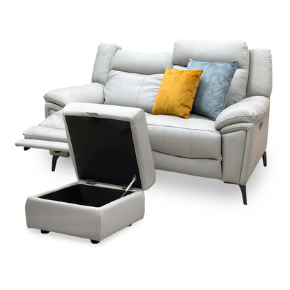 Panache lead grey leather 2 seater sofa reclined, seen from the left with the open storage footstool