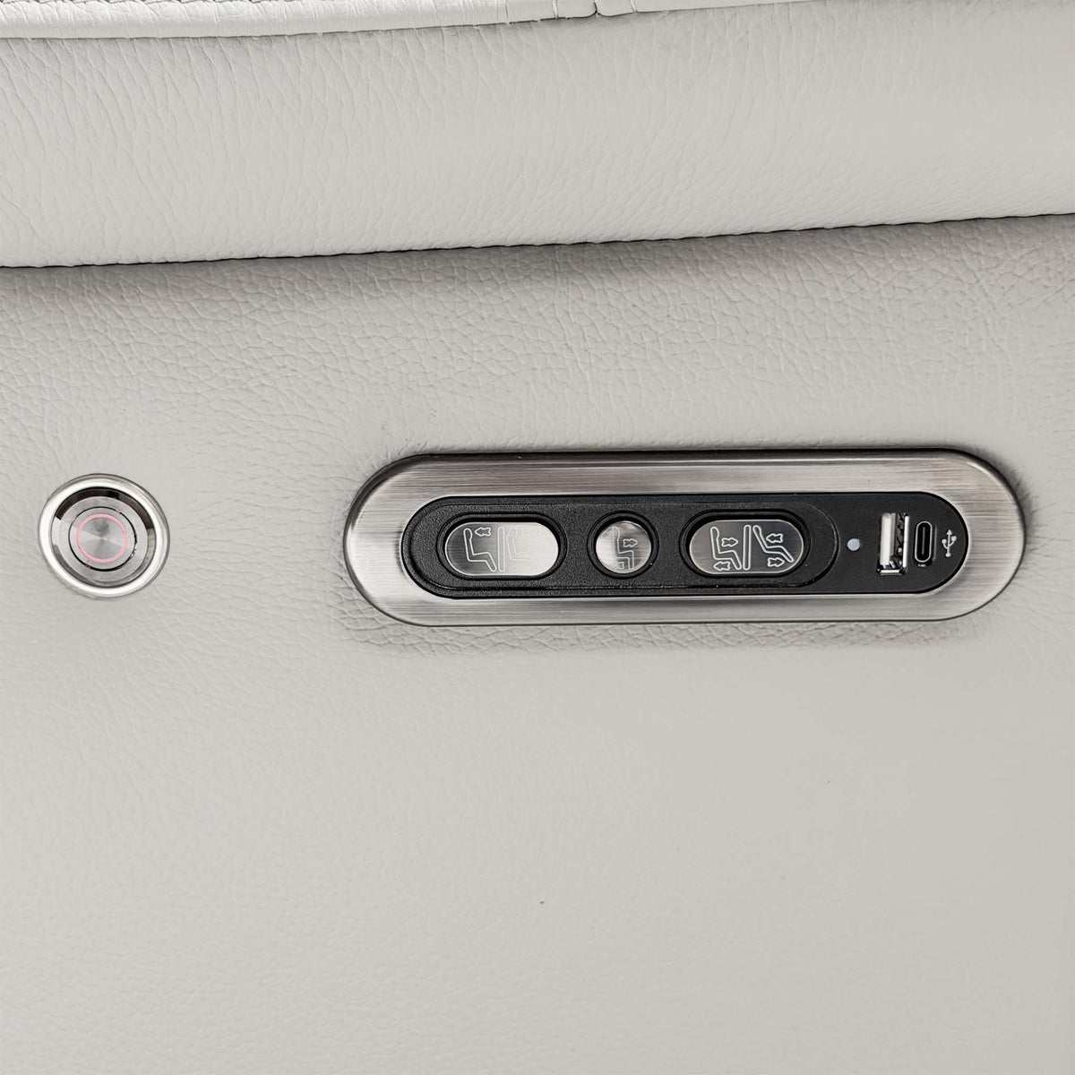 Close-up of the Panache sofa power recline controls with headrest buttons and a USB port on the leather arm