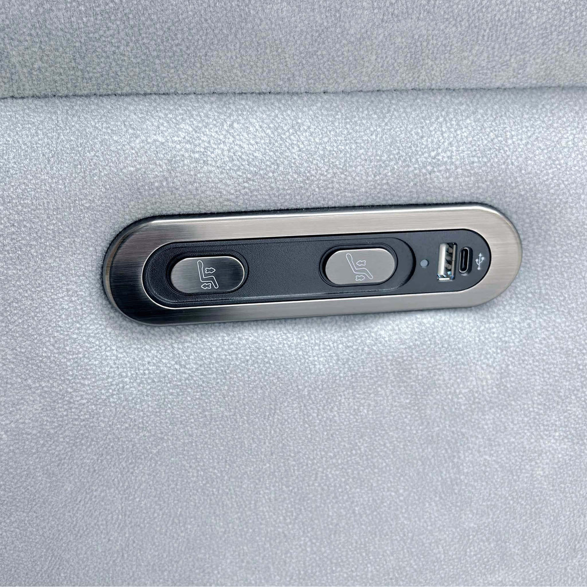 Close-up of the Morgan smoke grey sofa power recline buttons with USB-A and USB-C charging ports