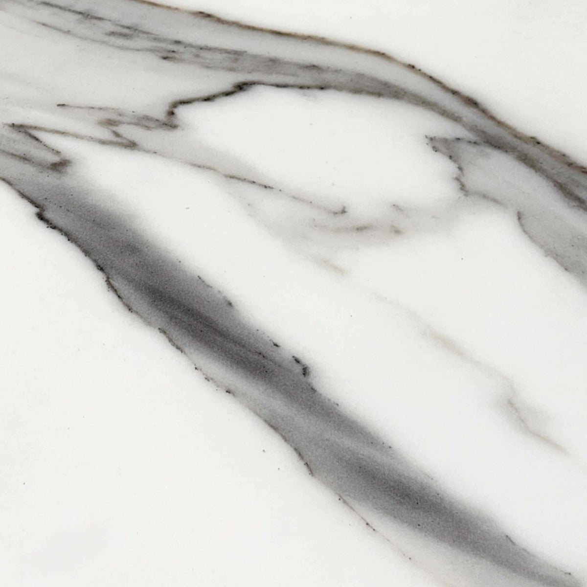 Close-up of the white Fiorentino marble effect ceramic used on the Jose dining table top