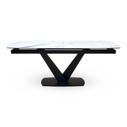 Front view of the Jose white marble effect ceramic dining table on its black V pedestal