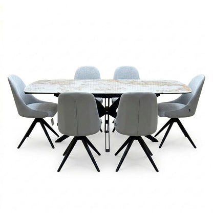 Front view of the Jose Calcatta marble dining table set with the draw leaves extended and six stone grey chairs