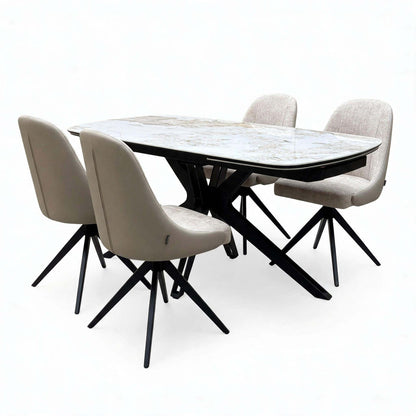 Jose Calcatta marble 160cm dining table with 4 beige fabric swivel chairs, angled from the left, two chairs facing forward