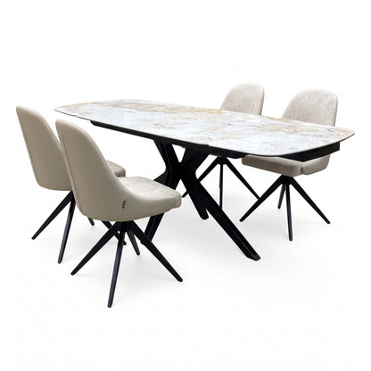 Jose Calcatta marble 160cm dining table extended, with 4 beige fabric swivel chairs, angled from the right