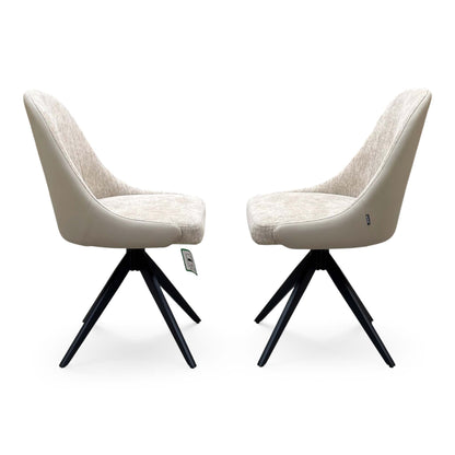Side view of the pair of Jose cream fabric armless swivel chairs from the set