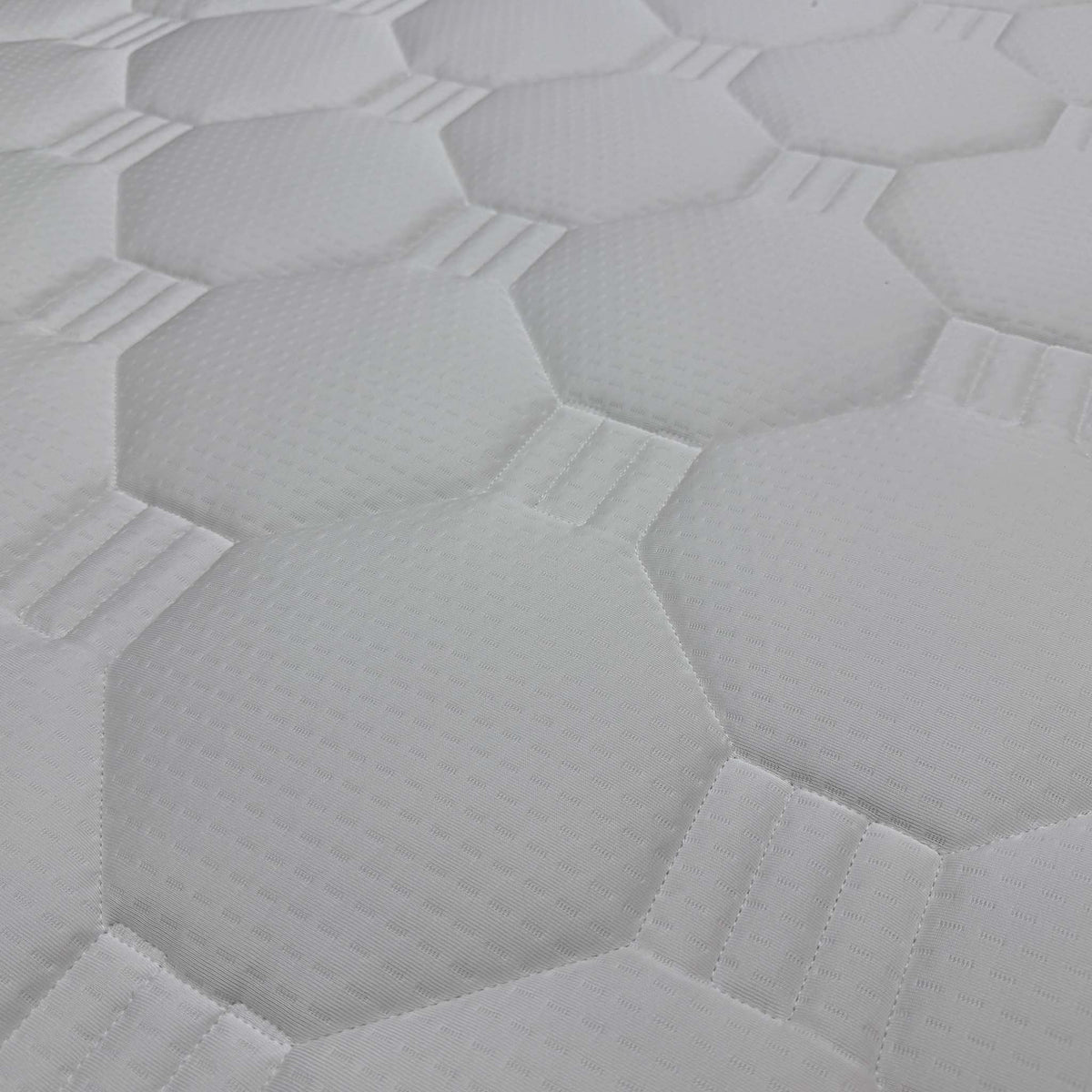 Close-up of the octagonal quilted top of the Nap 2000 natural pocket spring mattress