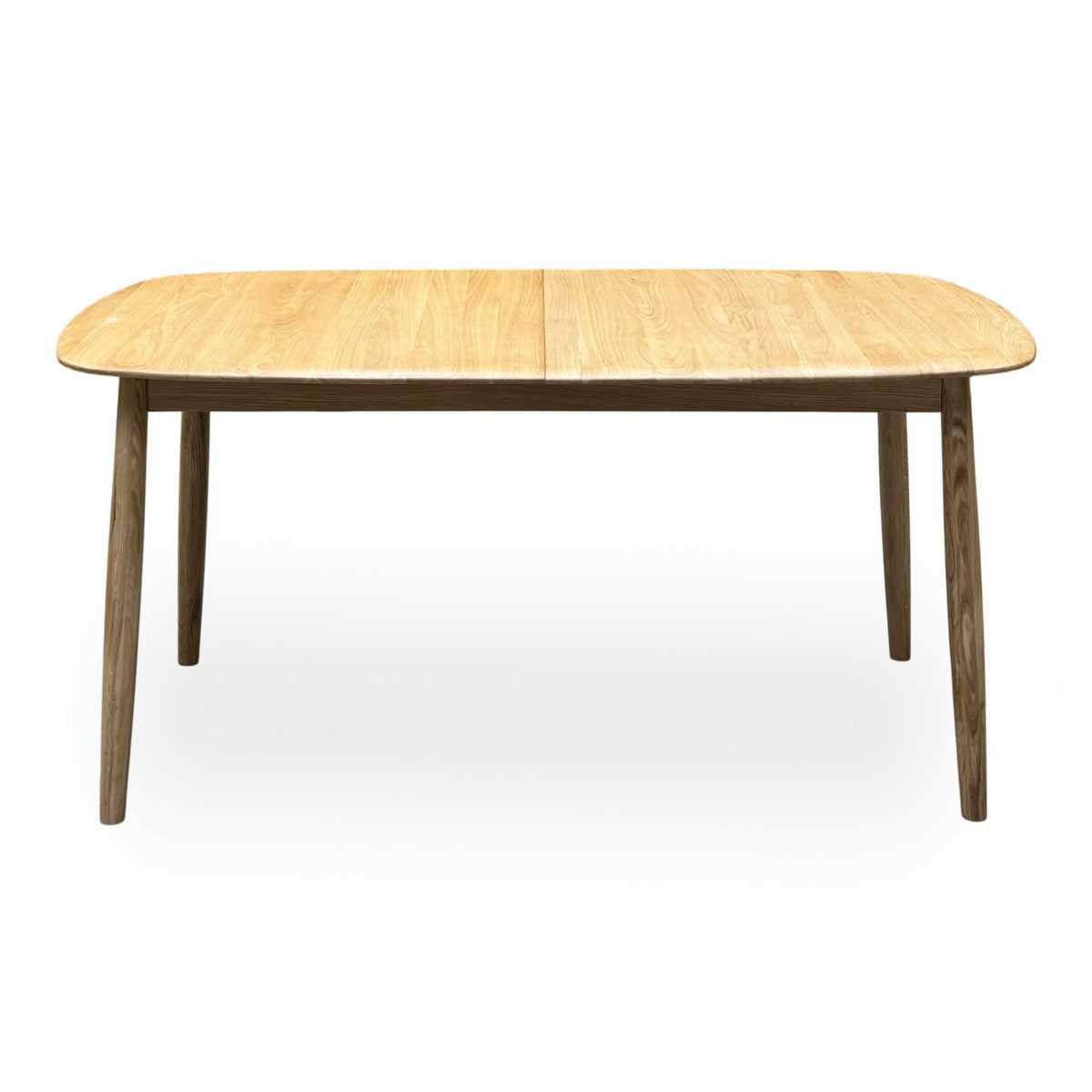 Front view of the Stockholm light oak extending dining table, closed, with darker tapered oak legs