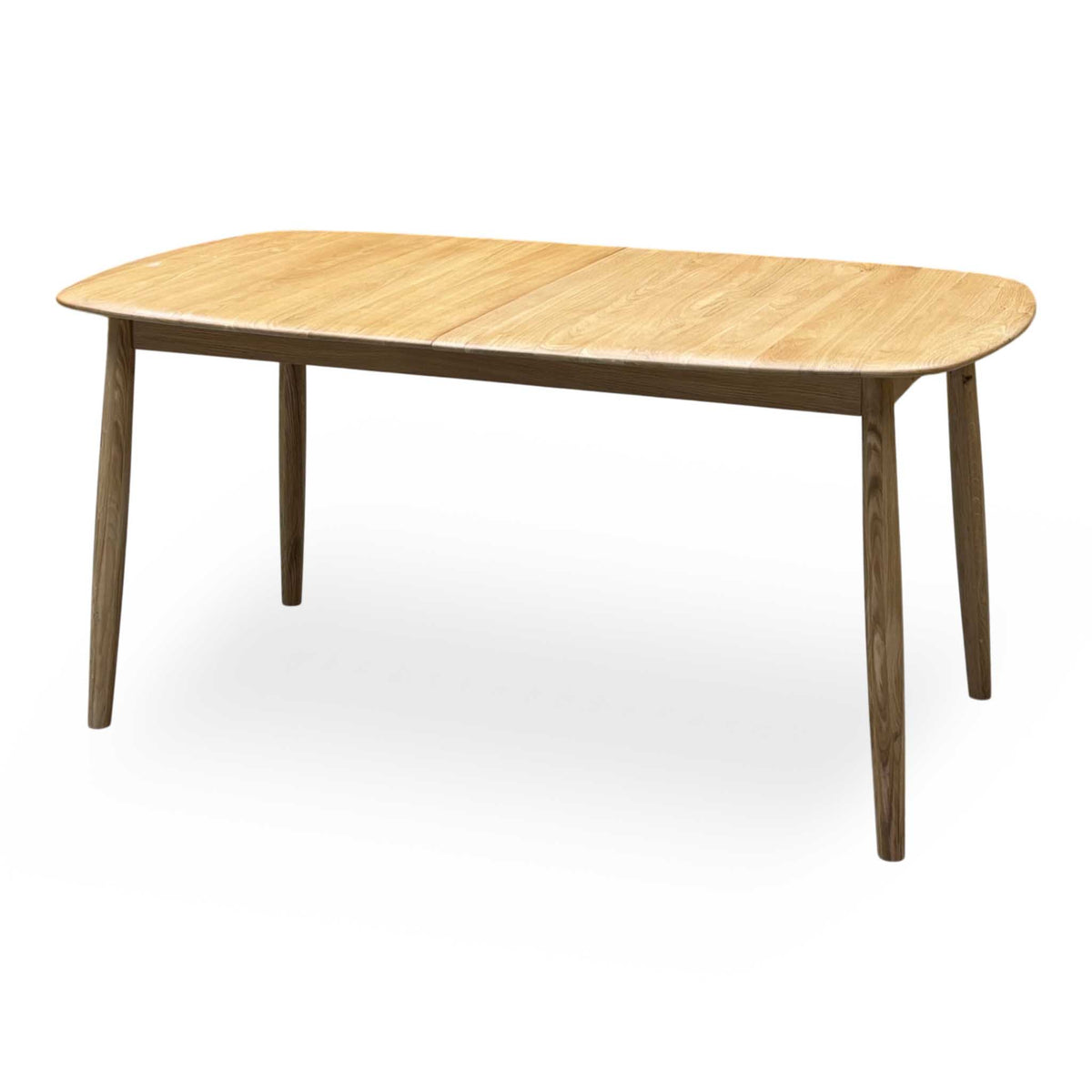 Stockholm light oak extending dining table, closed, three-quarter view from the right