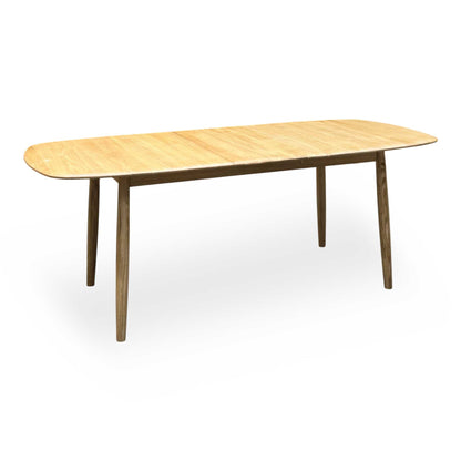Stockholm light oak large extending dining table, fully extended, angled view on tapered legs
