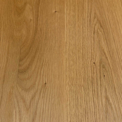 Close-up of the light oak grain used on the Stockholm solid oak dining table top