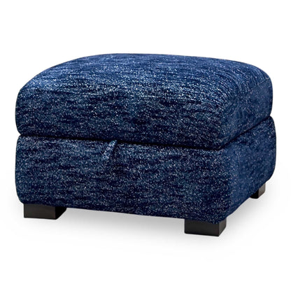 Nova dark denim blue woven fabric storage footstool, angled from the left showing the lid pull tab