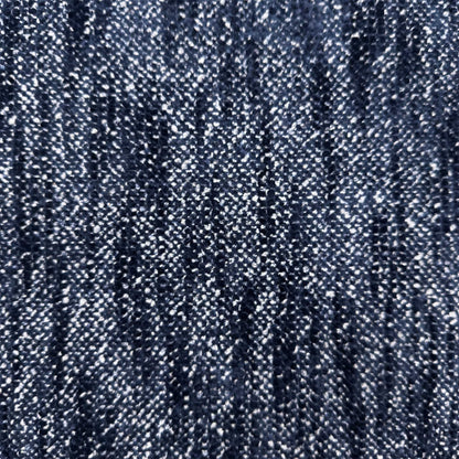 Close-up of the dark denim blue woven fabric used on the Nova storage footstool